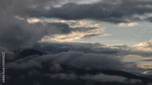 Experience the breathtaking beauty of a fast pan over the majestic Andes range in Ecuador during a mesmerizing sunset.