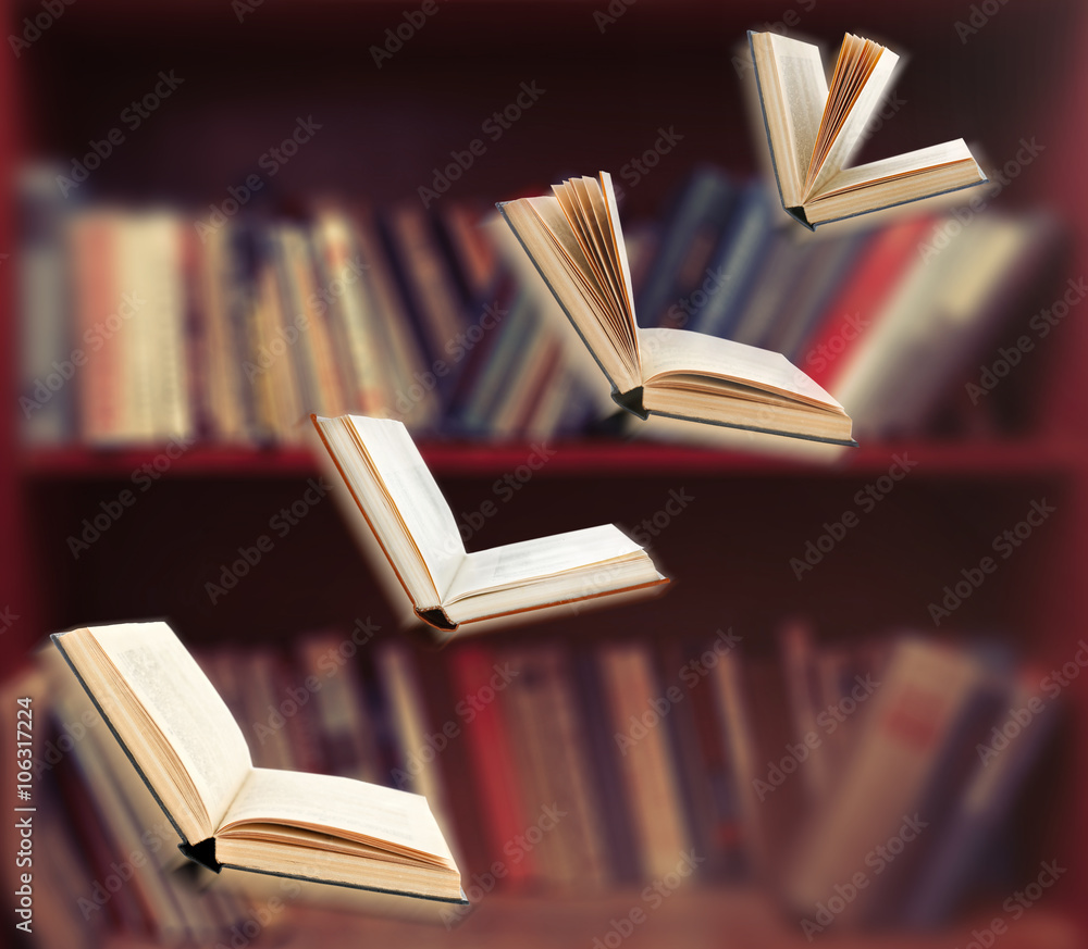 Fototapeta premium Flying open books in library