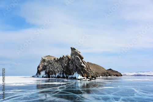 Rocky island in the middle of a frozen lake Baikal