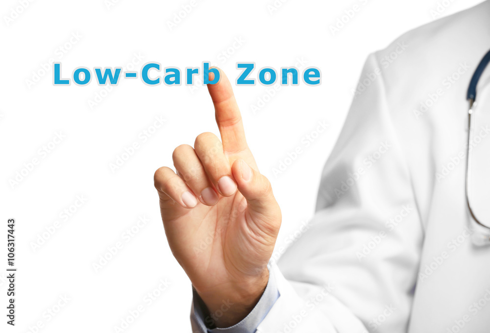 Doctor pointing on Low-Carb Zone text isolated on white Doctor pointing on Low-Carb Zone text isolated on white