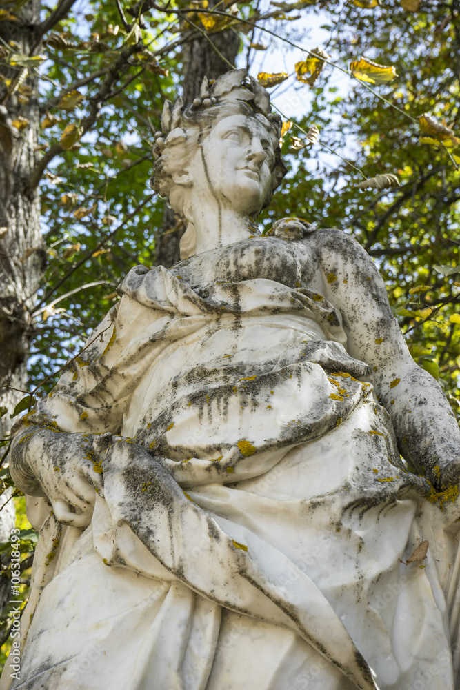 woman, white marble sculptures in the gardens of Segovia, Spain.