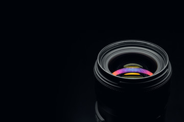 Camera lens close up on dark background