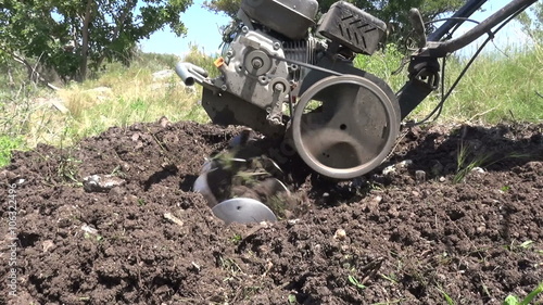 Wallpaper Mural Close up shot of a tillage cultivator in operation. Slow motion clip. Torontodigital.ca