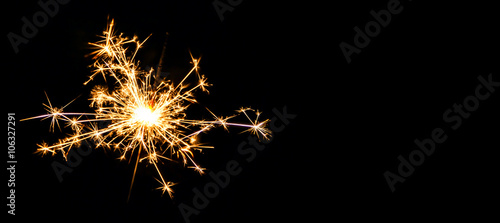 Canvas Print Christmas sparkler on black background. Bengal fire