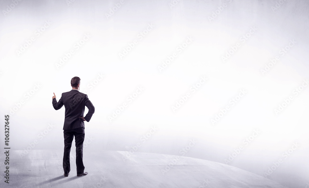 Business person standing from rear view Business person standing from rear view