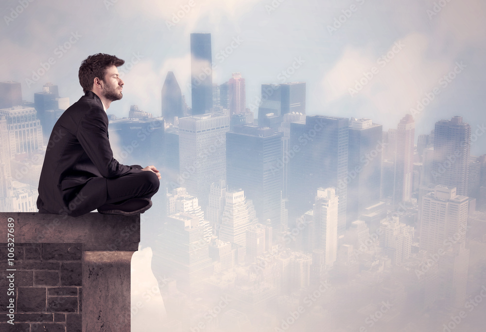 Sales person sitting on top of a tall building