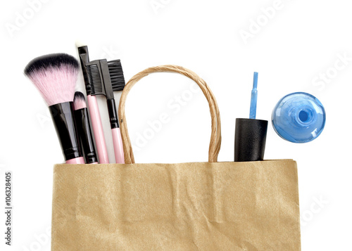 Shopping cosmetic accessory in bag isolate on white.