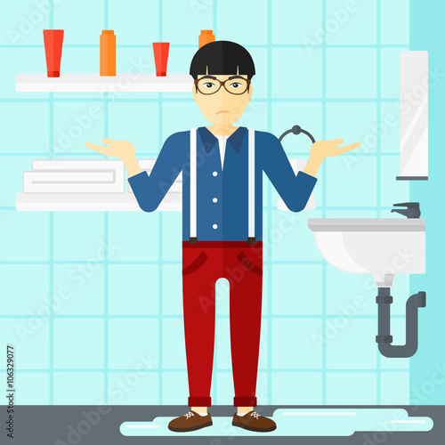 Man in despair standing near leaking sink.