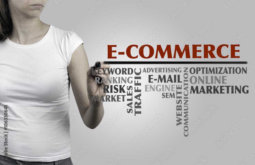 Beautiful woman writing - E-Commerce word cloud, business concep Beautiful woman writing - E-Commerce word cloud, business concep