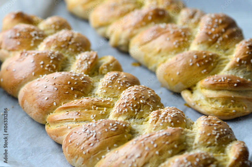 Fresh braided bread with sesame seeds