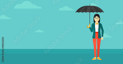 Business woman standing with umbrella. © Visual Generation