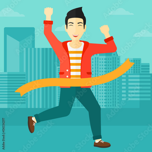 Businessman crossing finish line.
