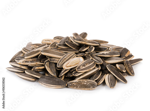 sunflower seeds pile against white background