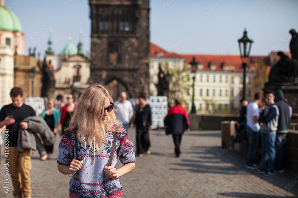 girl walking on the bridge in Prague