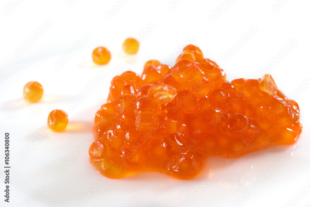 Isolated image of red caviar on a white background closeup Isolated image of red caviar on a white background closeup