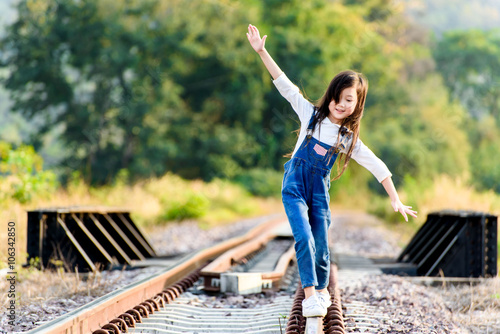 Girl walk on the railway