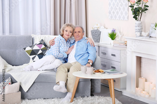 Mature couple sitting toget...