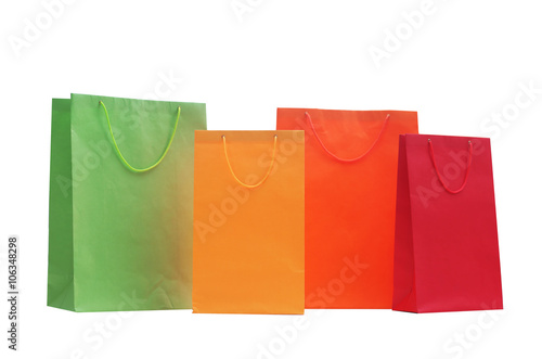 Coloured shopping bags on bright background