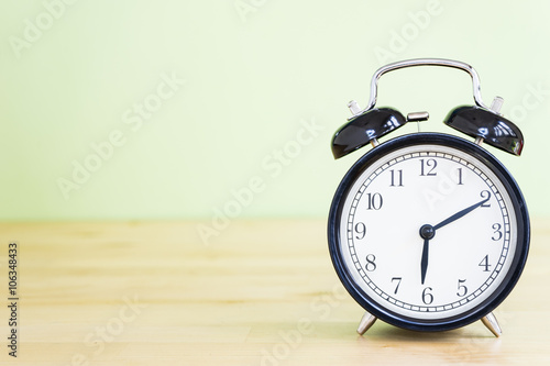 alarm clock on wood table