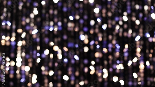Abstract glittering lights, silver background, a real shot video in the blur