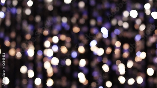 Abstract glittering lights, silver background, a real shot video in the blur