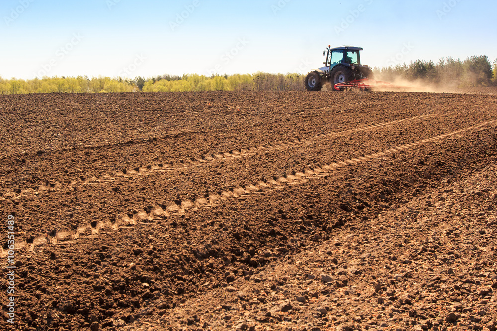 cultivator operates on ploughed field makes dust cultivator operates on ploughed field makes dust
