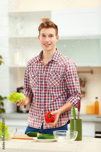 Happy handsome man with veg...