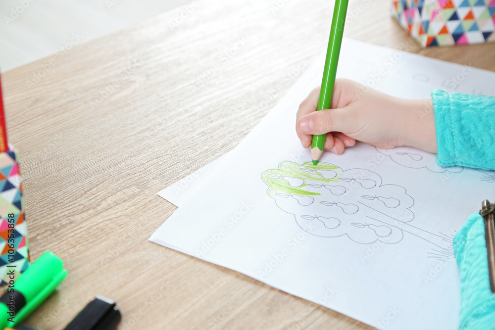 Little girl learning to draw at the table Little girl learning to draw at the table