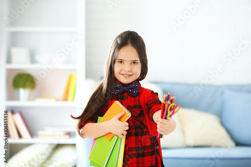 Little girl with red back p...
