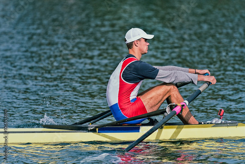 Single scull rowing competitor