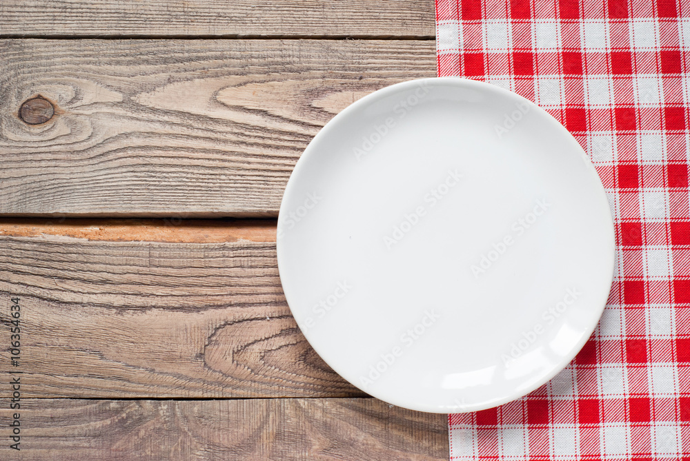Table setting with a plate, cutlery and napkin Table setting with a plate, cutlery and napkin