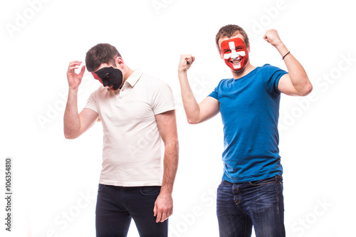 Albania vs Switzerland. Football fans of national teams demonstrate emotions: Albania lose, Switzerland win. European 2016 football fans concept.