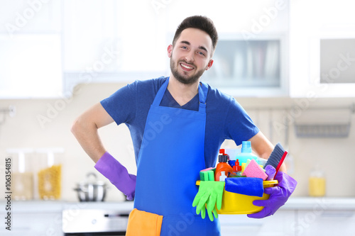 Man holding plastic basin w...
