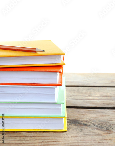 Few books and pencil on table