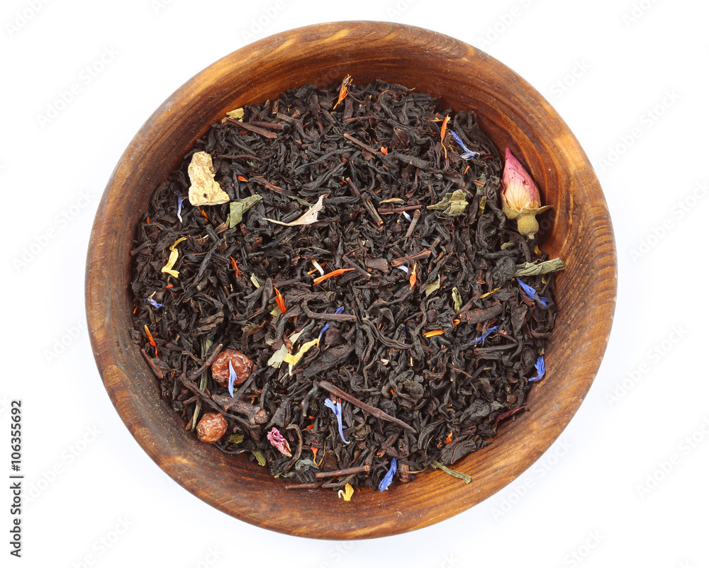 Dry tea in saucer isolated on white Dry tea in saucer isolated on white