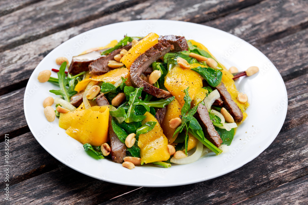 Fresh Tasty Mango, beef salad with vegetables and nuts. Fresh Tasty Mango, beef salad with vegetables and nuts.