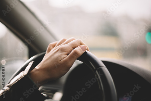 Wallpaper Mural Close-up of a woman's hand driving a car Torontodigital.ca