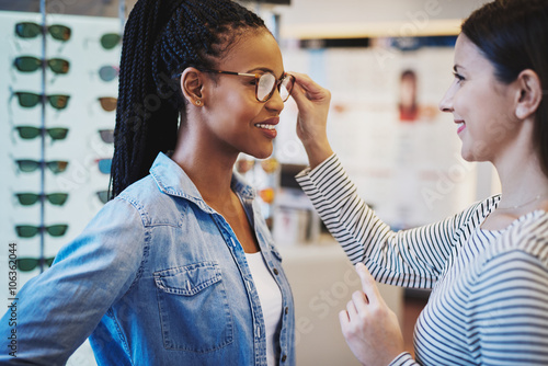 Optometrist helping a pretty African client