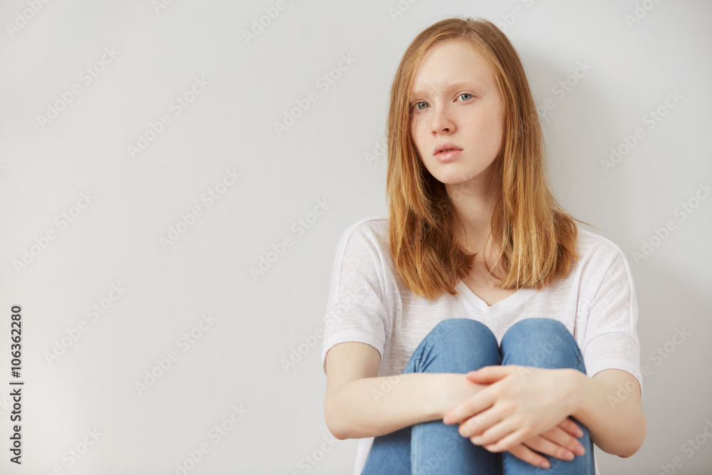 young pretty teenage girl sitting on floor at home despair sad alone, lifestyle concept young pretty teenage girl sitting on floor at home despair sad alone, lifestyle concept