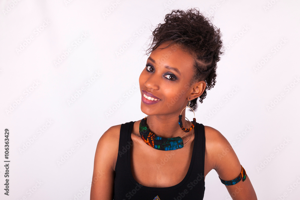 Beautiful African American woman with curly hairs isolated on wh Beautiful African American woman with curly hairs isolated on wh