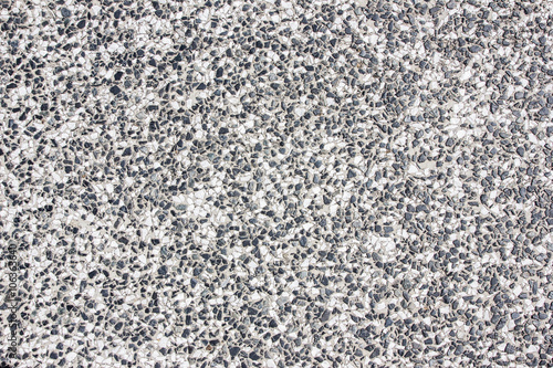 Gray rough grainy granite wall bacgkround.