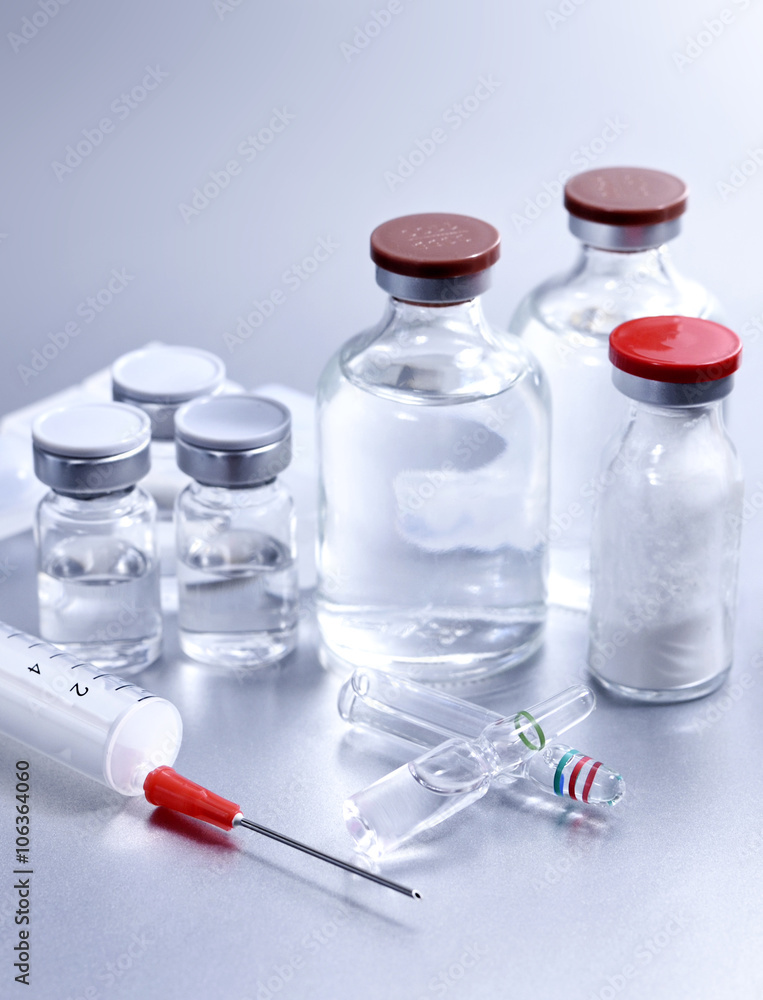 Vials and syringe, studio shot. Medical objects for vaccination. Vials and syringe, studio shot. Medical objects for vaccination.