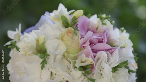 Bride's bouquet of roses rotation against green background