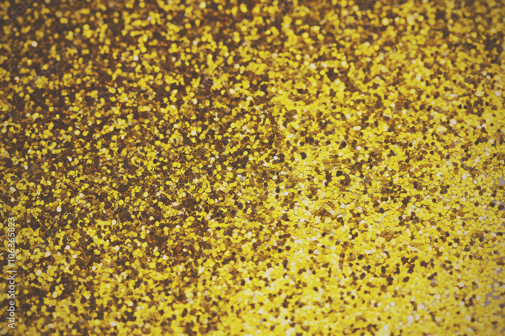 Close up a fine shining gold glitter Close up a fine shining gold glitter