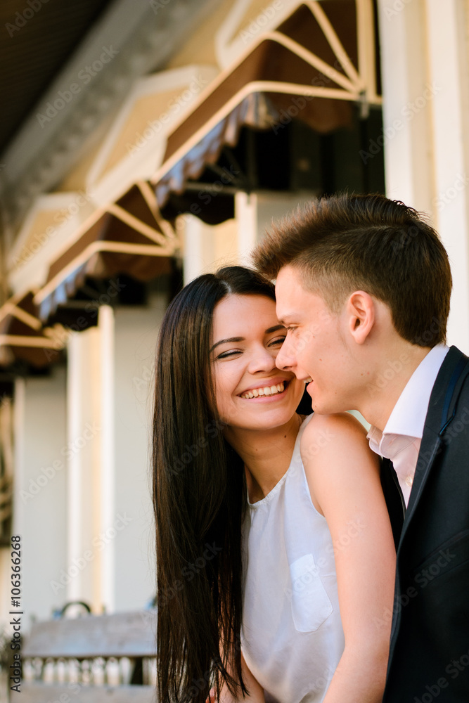 Couple kissing happiness fun. Interracial young couple embracing laughing on date. Couple kissing happiness fun. Interracial young couple embracing laughing on date.