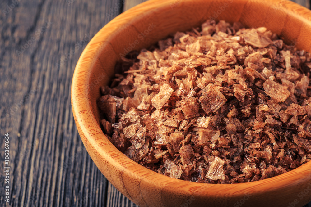 Crystal flakes of smoked natural sea salt. Crystal flakes of smoked natural sea salt.