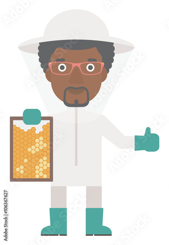 Bee-keeper at apiary.