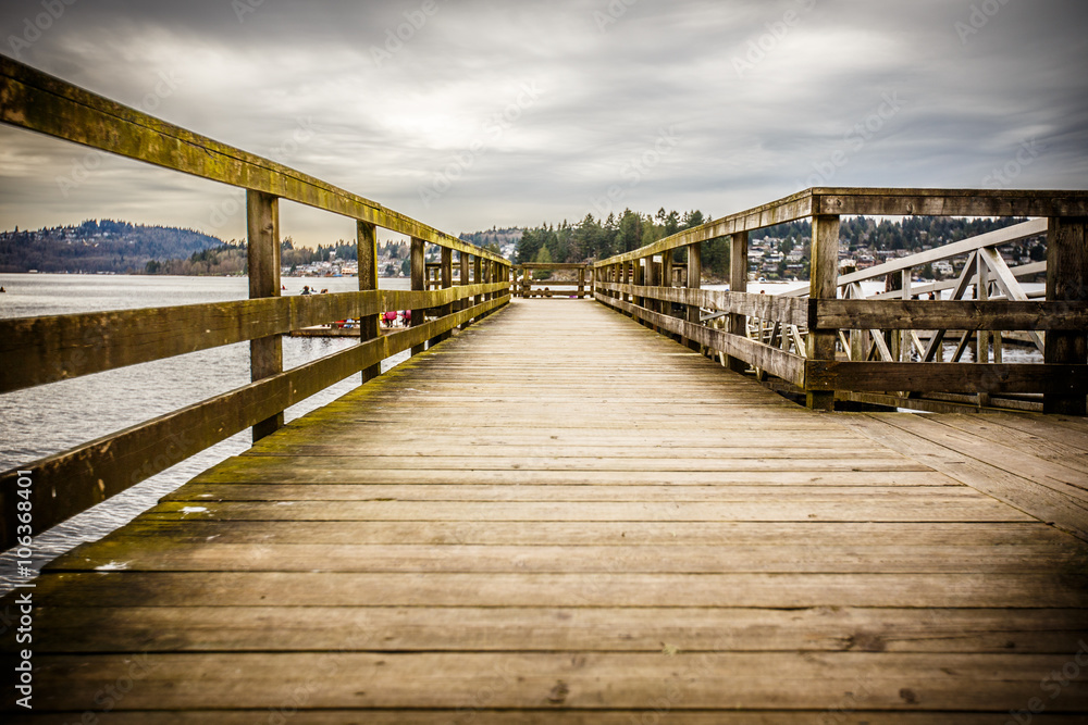 Gritty wooden pier on a cloudy day