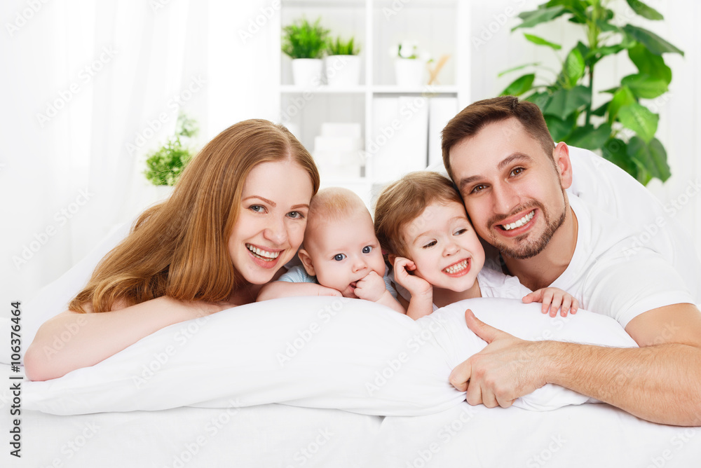 happy family at home in the bed happy family at home in the bed
