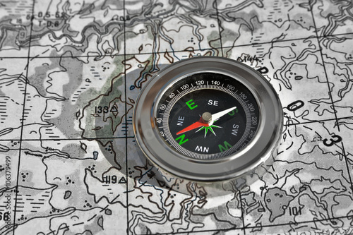 Navigation: compass and a map. © sergunt
